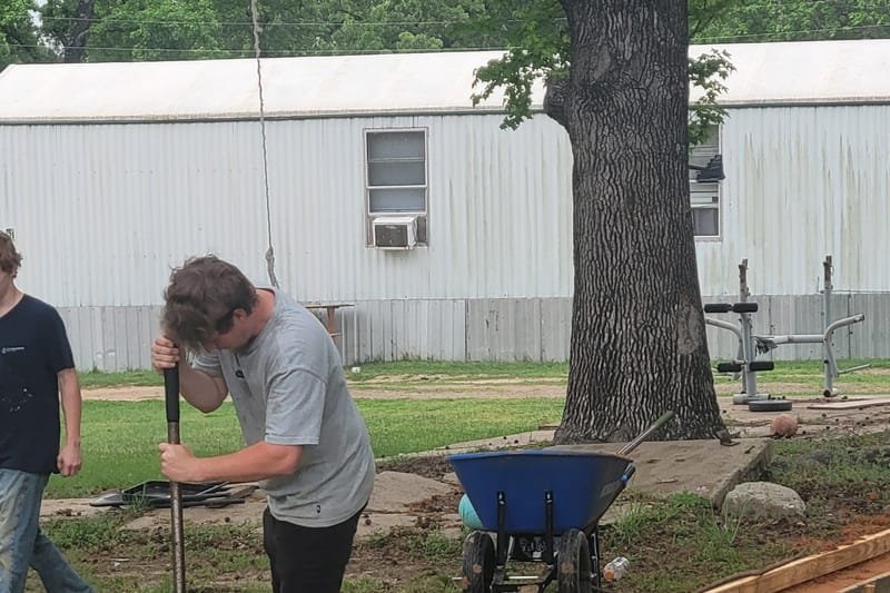 Crew setting wood forms for concrete