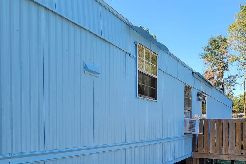 Mobile home after a fresh coat of light blue paint