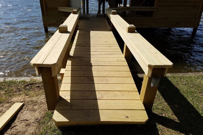 Pier walkway lined with built-in benches on both sides
