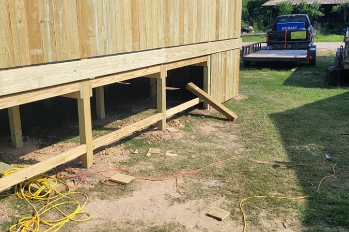 Tall privacy wall along the back of a raised pool deck