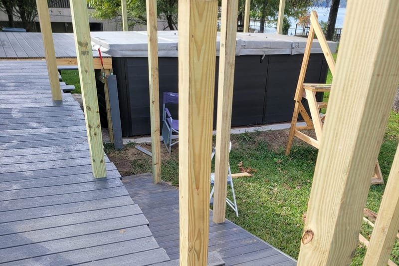 Gray composite ramp decking with new treated posts