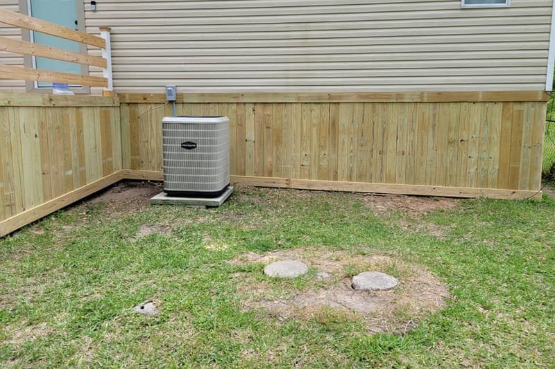 Wood skirting along the side of a mobile home